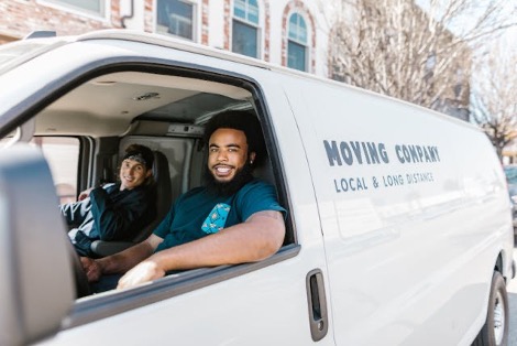 Two men sitting in a white van